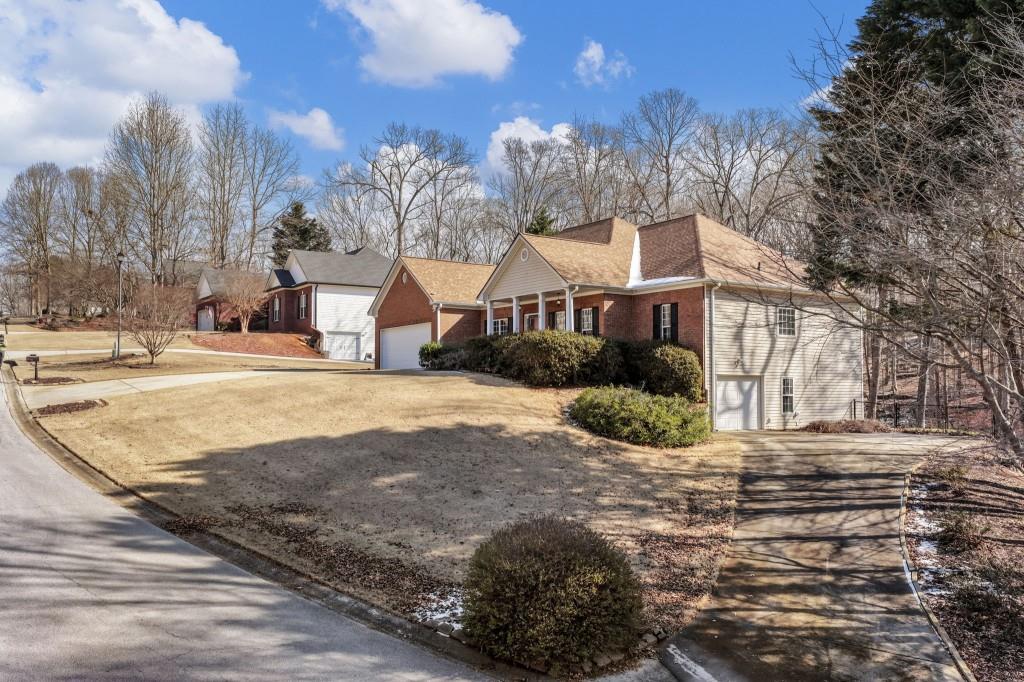 799 Gold Crest Road Braselton, GA 30517 - Photo 71 of 71 a front view of a house with a yard