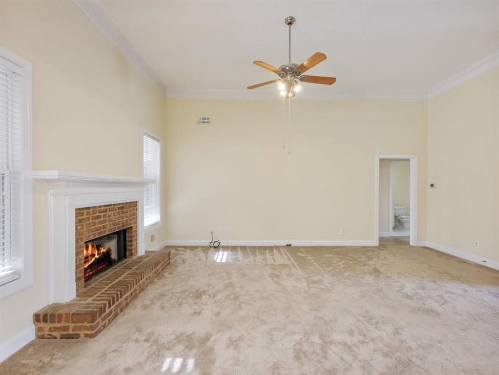 799 Gold Crest Road Braselton, GA 30517 - Photo 8 of 71 a view of an empty room with a fireplace