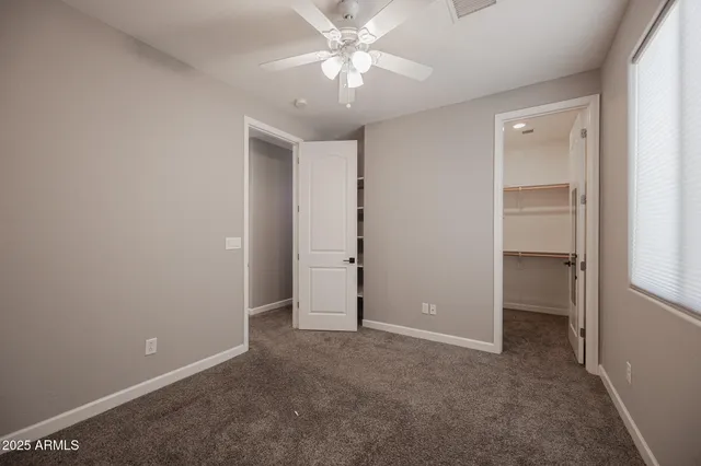 a view of a hallway with washer and dryer