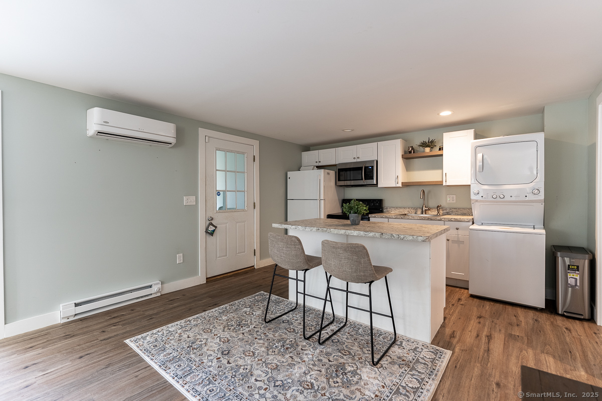 147 Pequot Avenue Groton, CT 06355 - Photo 18 of 39 a kitchen with stainless steel appliances granite countertop a refrigerator sink and stove