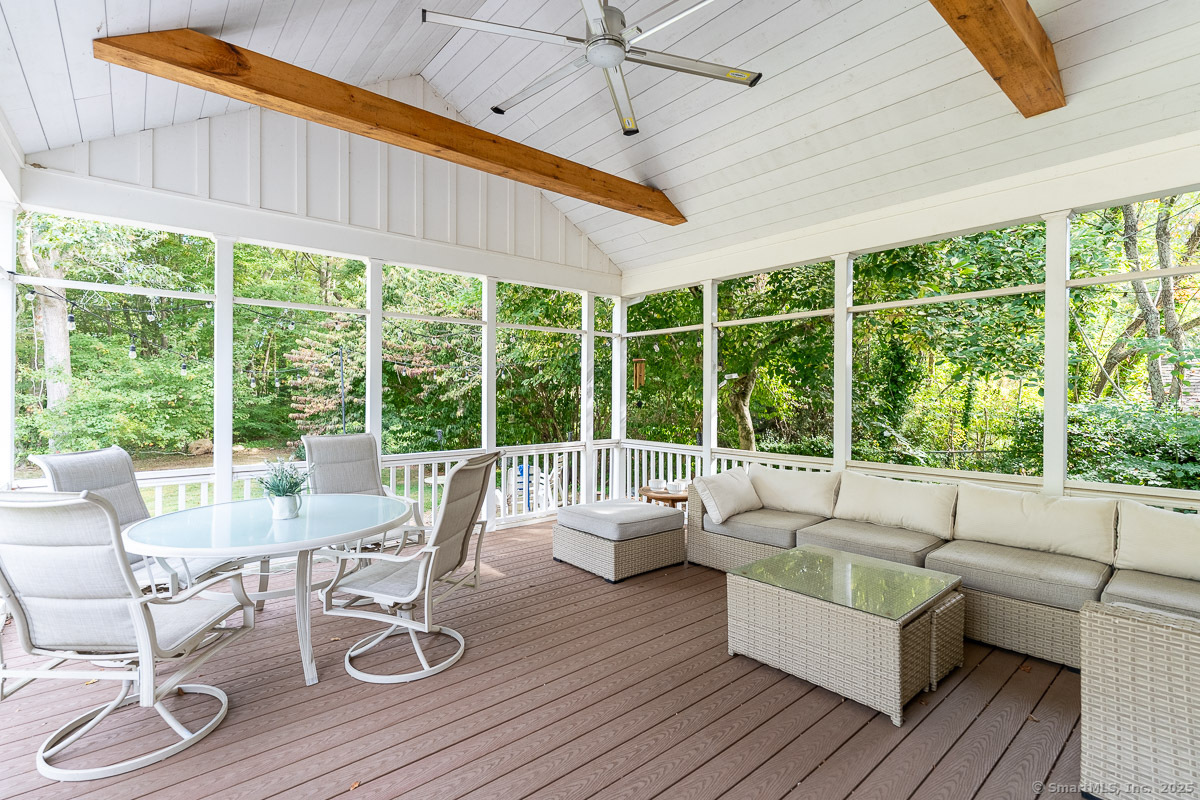 147 Pequot Avenue Groton, CT 06355 - Photo 34 of 39 a living room with furniture and floor to ceiling windows