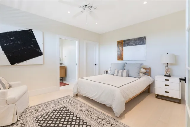 a bedroom with a bed and a view of bathroom