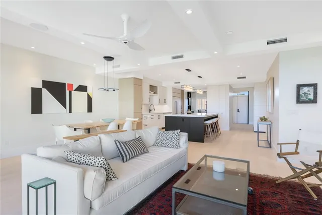 a living room with furniture and a table