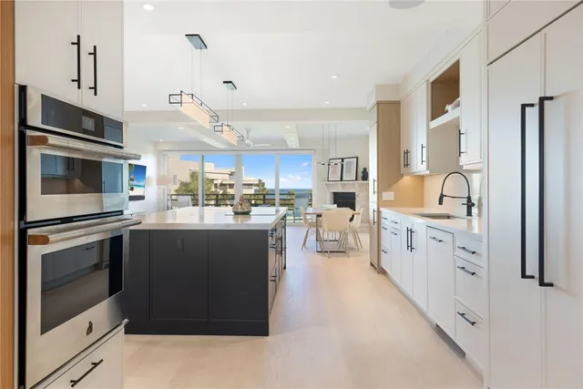 a kitchen with counter top space stainless steel appliances and cabinets