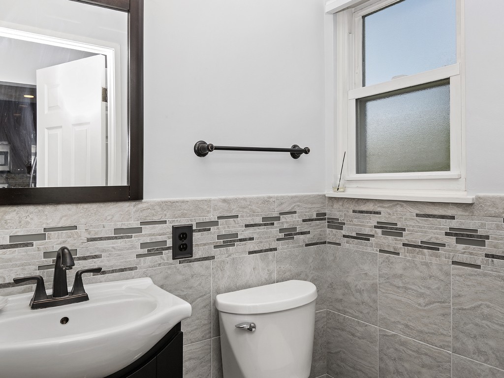 2255 Commonwealth Avenue, Unit 2255 Newton, MA 02466 - Photo 11 of 32 a bathroom with a sink and a toilet