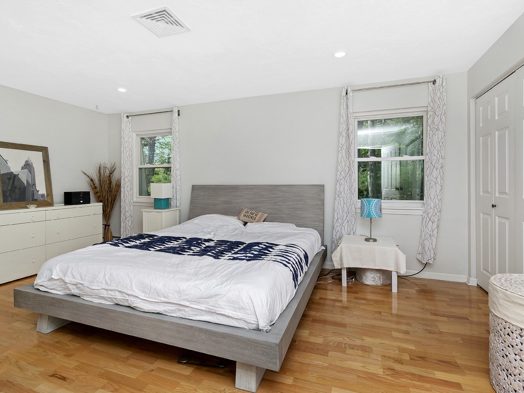 2255 Commonwealth Avenue, Unit 2255 Newton, MA 02466 - Photo 13 of 32 a bedroom with a bed and a large window