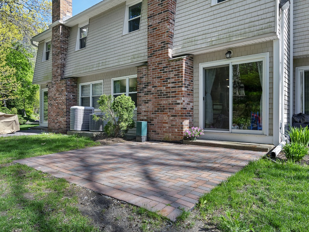 2255 Commonwealth Avenue, Unit 2255 Newton, MA 02466 - Photo 26 of 32 a front view of a house with garden