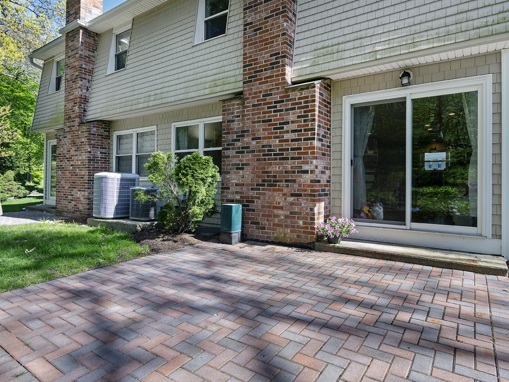 2255 Commonwealth Avenue, Unit 2255 Newton, MA 02466 - Photo 27 of 32 a front view of a house with a garden
