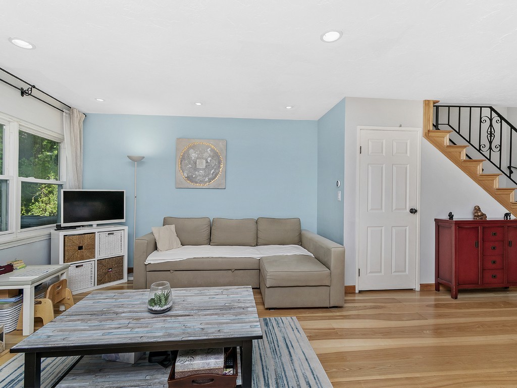 2255 Commonwealth Avenue, Unit 2255 Newton, MA 02466 - Photo 7 of 32 a living room with furniture and a flat screen tv