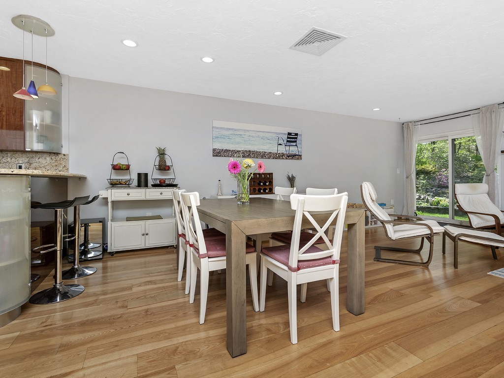 2255 Commonwealth Avenue, Unit 2255 Newton, MA 02466 - Photo 8 of 32 a dining room with furniture and window