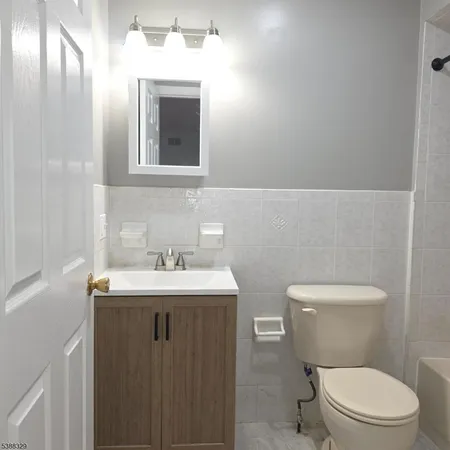a bathroom with a shower and a bath tub