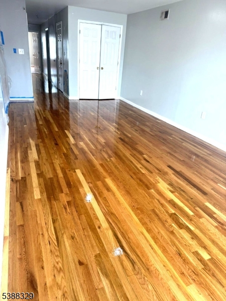 22 Boylan Street, Unit 1 Newark, NJ 07106 - Photo 21 of 27 a view of an empty room with wooden floor and a window