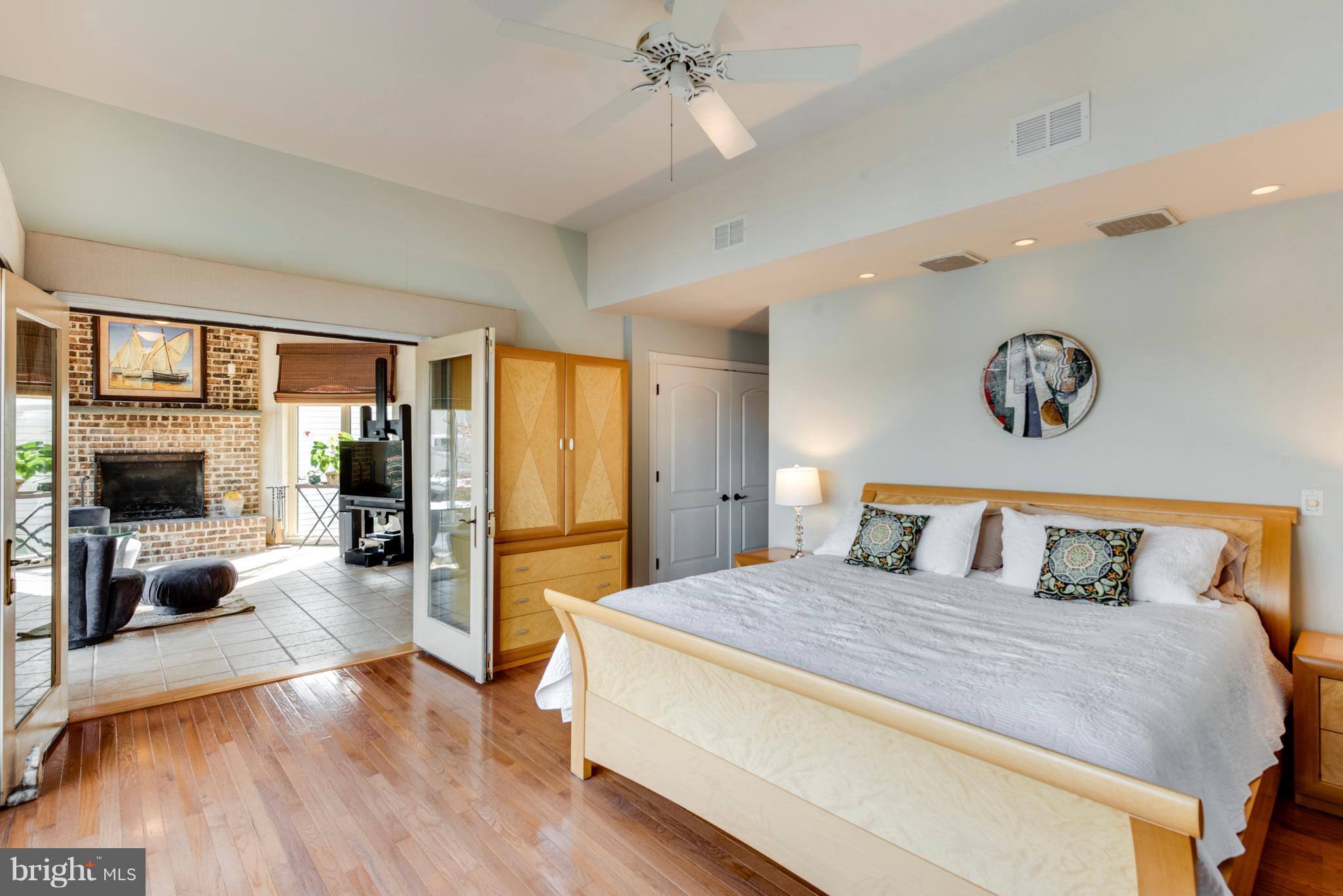 1795 Beachfield Road Annapolis, MD 21409 - Photo 34 of 49 a spacious bedroom with a bed and a large mirror