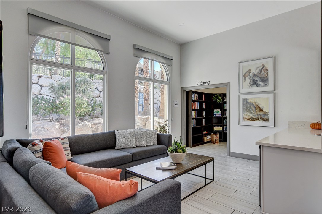 2555 Hampton Road, Unit 2207 Henderson, NV 89052 - Photo 71 of 74 Arch-top windows illuminate a comfortable sitting area with a convenient library access.