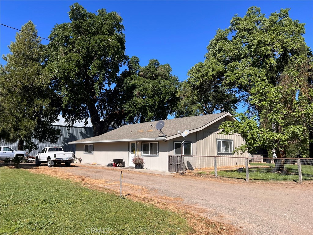 5000 Ord Ferry Chico, CA 95928 - Photo 19 of 22 a view of a white house with a big yard and large trees