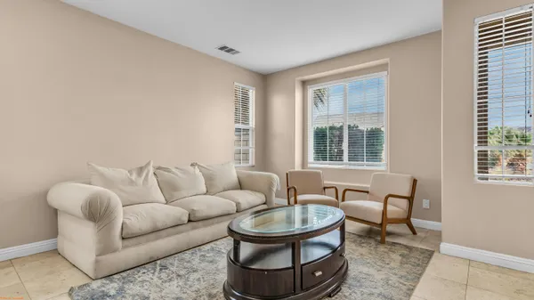 a view of a dining room with furniture and window