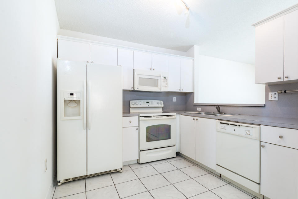 17841 Southwest 144th Avenue Miami, FL 33177 - Photo 14 of 19 a kitchen with cabinets stainless steel appliances and a sink