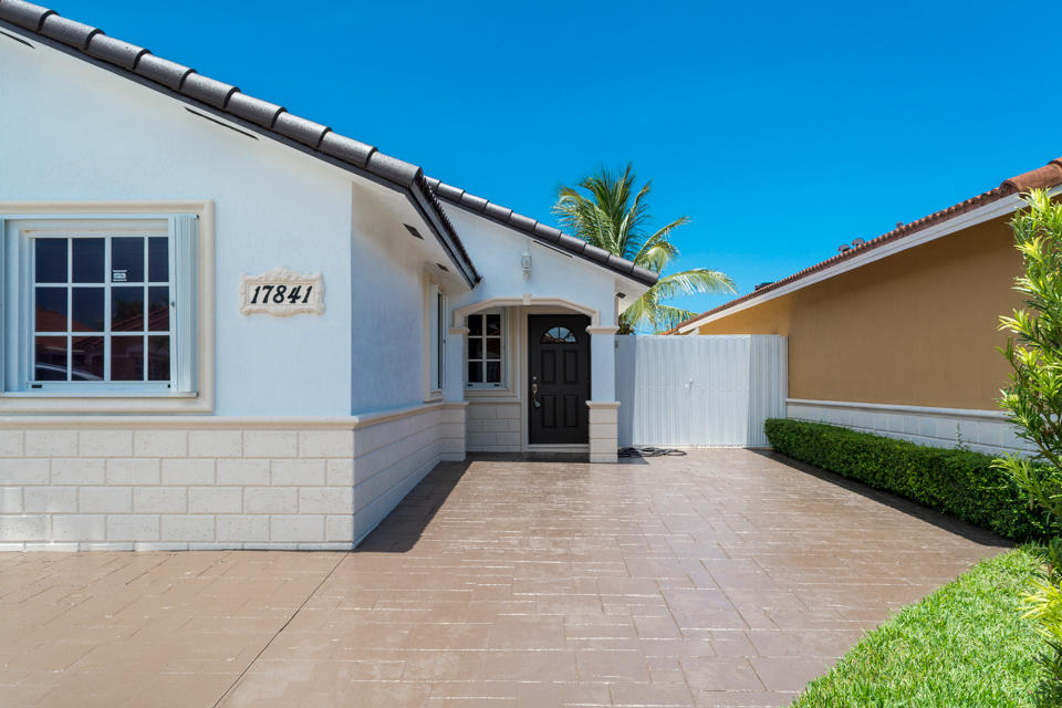 17841 Southwest 144th Avenue Miami, FL 33177 - Photo 2 of 19 a view of entrance gate of the house