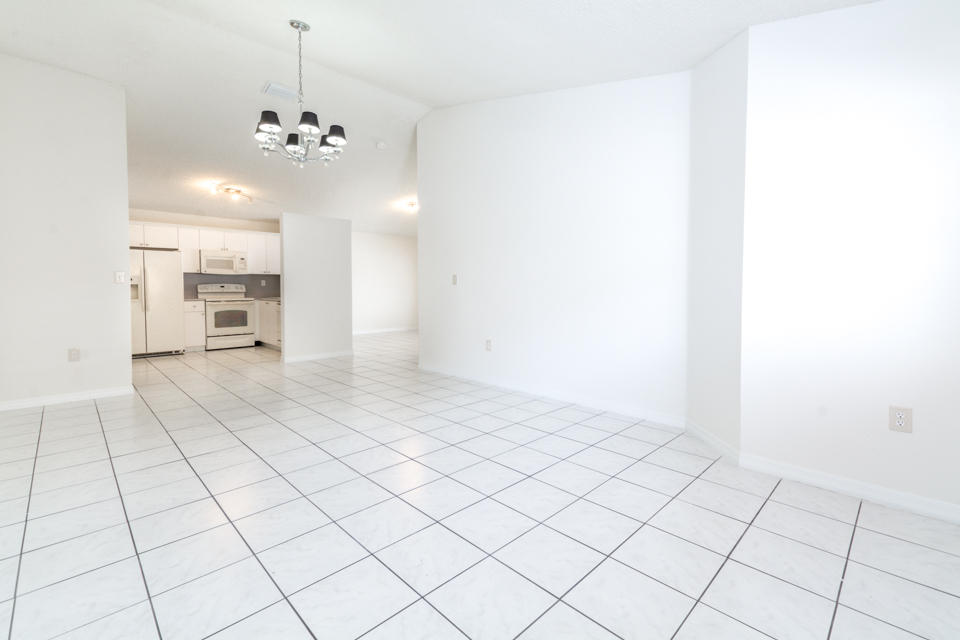 17841 Southwest 144th Avenue Miami, FL 33177 - Photo 4 of 19 a view of an empty room and chandelier fan