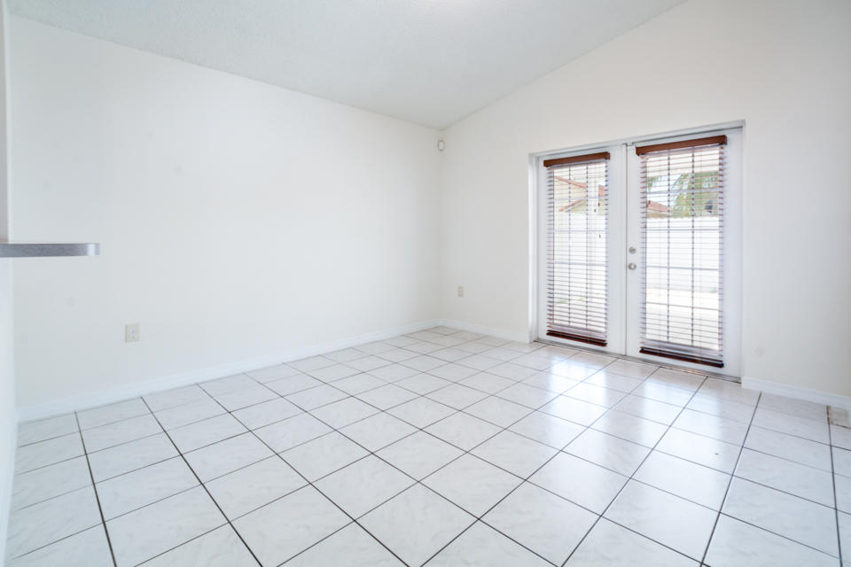 17841 Southwest 144th Avenue Miami, FL 33177 - Photo 7 of 19 a view of an empty room and window