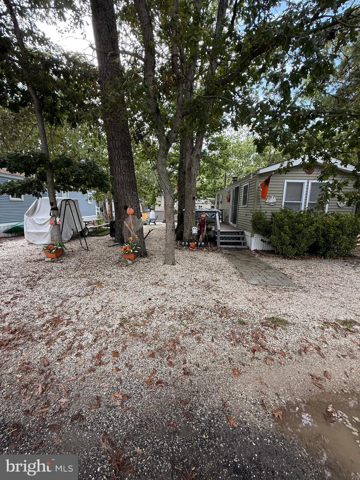 515 Corsons Tavern Road, Unit F49 Ocean View, NJ 08230 - Photo 2 of 12 a view of a outdoor space with furniture and garden