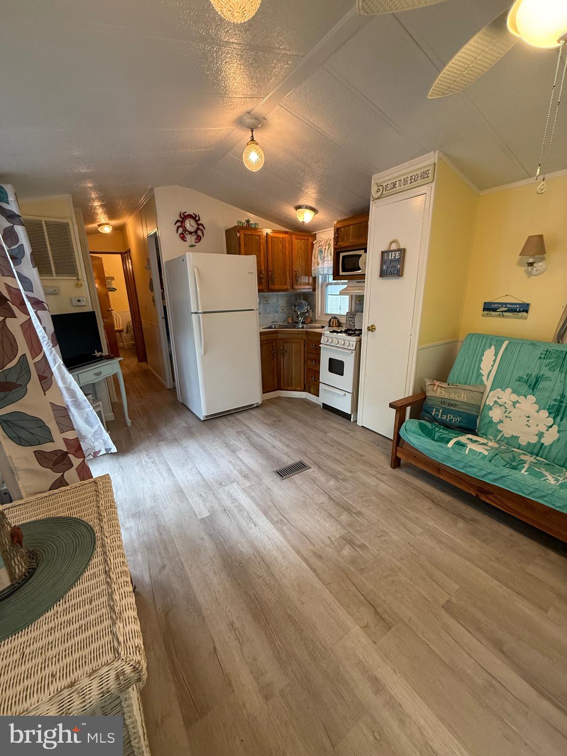 515 Corsons Tavern Road, Unit F49 Ocean View, NJ 08230 - Photo 3 of 12 a room with furniture and a wooden floor