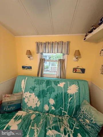 a room with potted plants and white walls