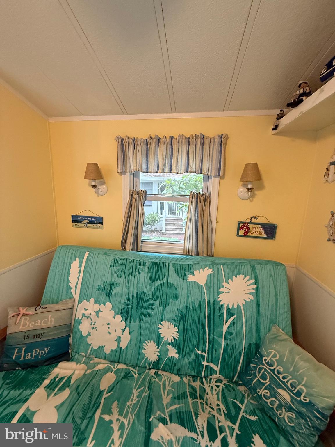 515 Corsons Tavern Road, Unit F49 Ocean View, NJ 08230 - Photo 6 of 12 a room with potted plants and white walls