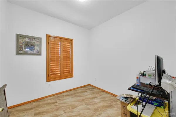 a view of workspace with wooden floor