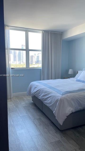 2475 Brickell Avenue, Unit 1704 Miami, FL 33129 - Photo 12 of 13 a bedroom with a bed and a window