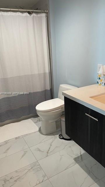 2475 Brickell Avenue, Unit 1704 Miami, FL 33129 - Photo 10 of 13 a bathroom with a sink toilet and shower
