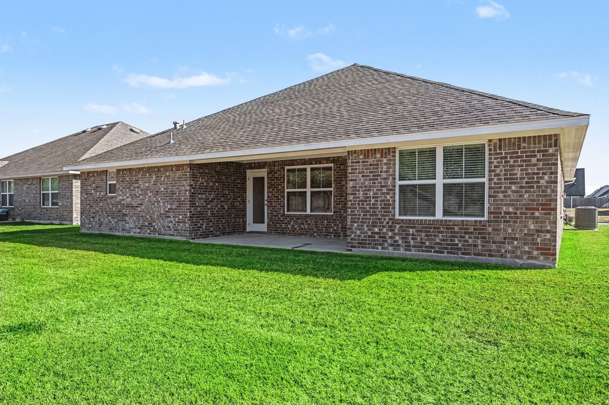 601 Greystone Lane Angleton, TX 77515 - Photo 30 of 32 a front view of a house with a garden