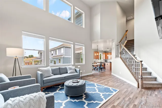 a living room with furniture and a table