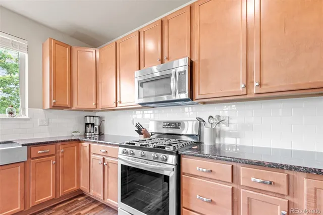 a spacious bathroom with a sink and mirror