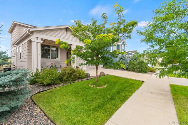 a view of a chairs and table in the balcony