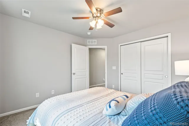 a bathroom with a sink a toilet a mirror and shower