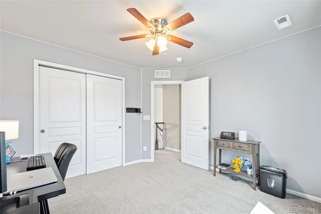 a view of a patio with table and chairs and potted plants