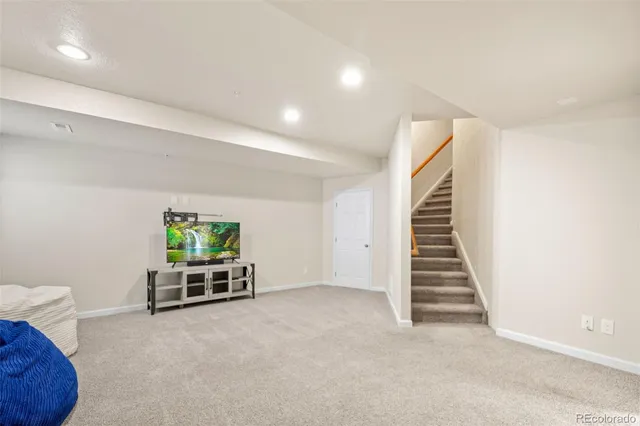 a front view of a house with a garden and plants
