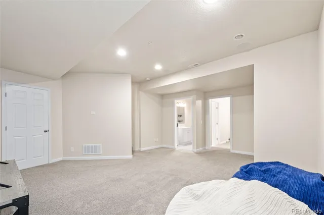 a view of a house with a yard and a garden