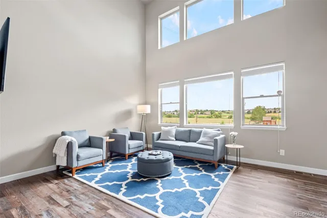 a view of a dining room with furniture window and wooden floor