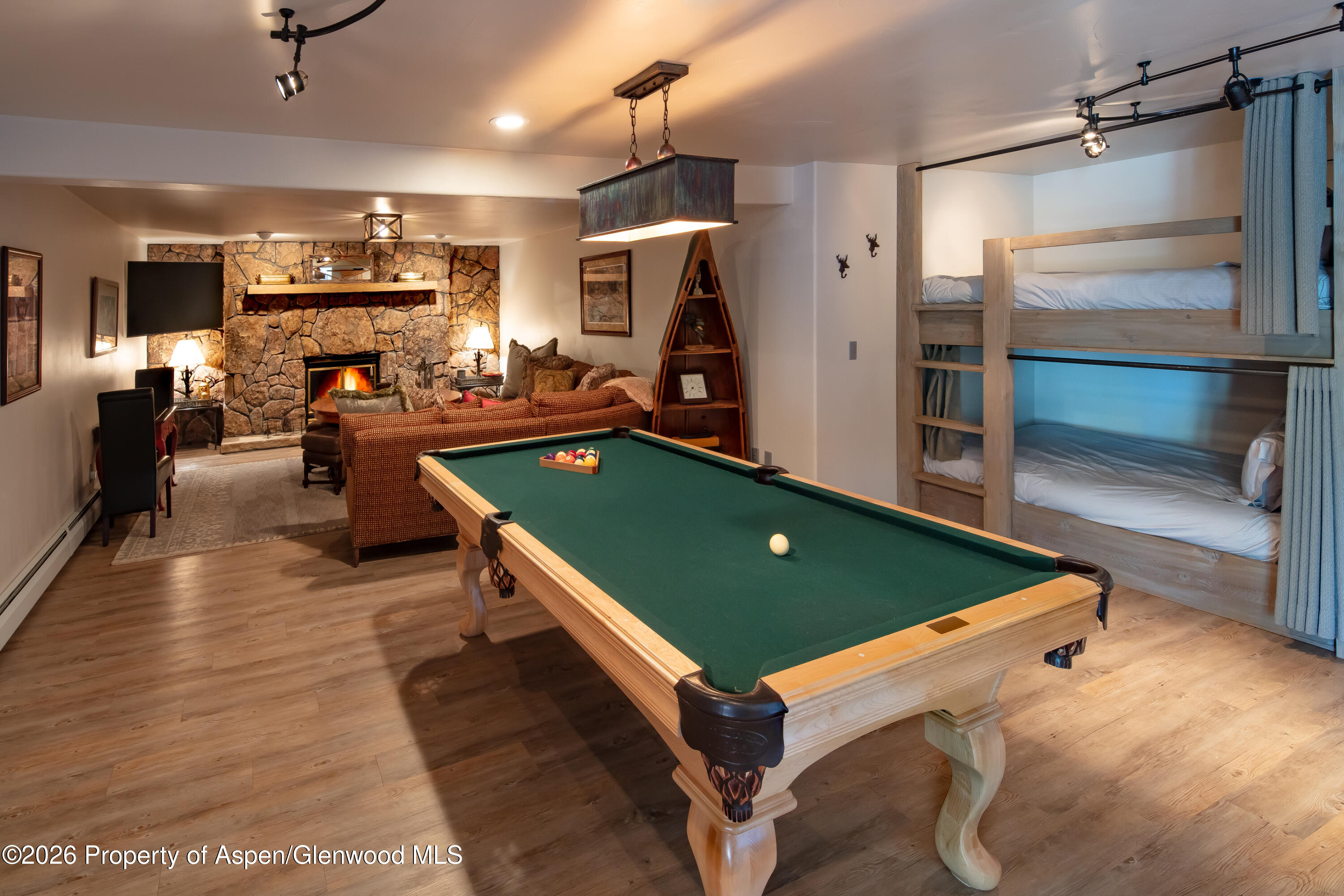 294 Ruedi Creek Road Basalt, CO 81621 - Photo 24 of 27 a room with wooden floor pool table and chairs
