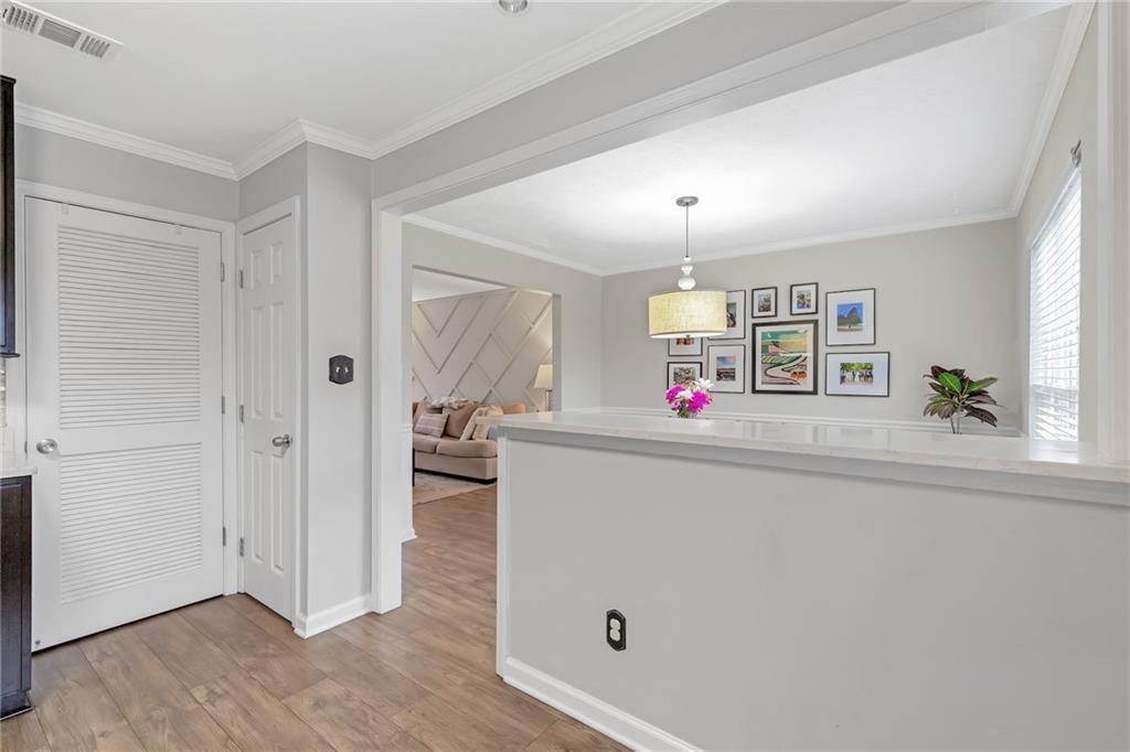 12 Surry County Place Northwest Atlanta, GA 30318 - Photo 12 of 27 wooden floor with white walls and window