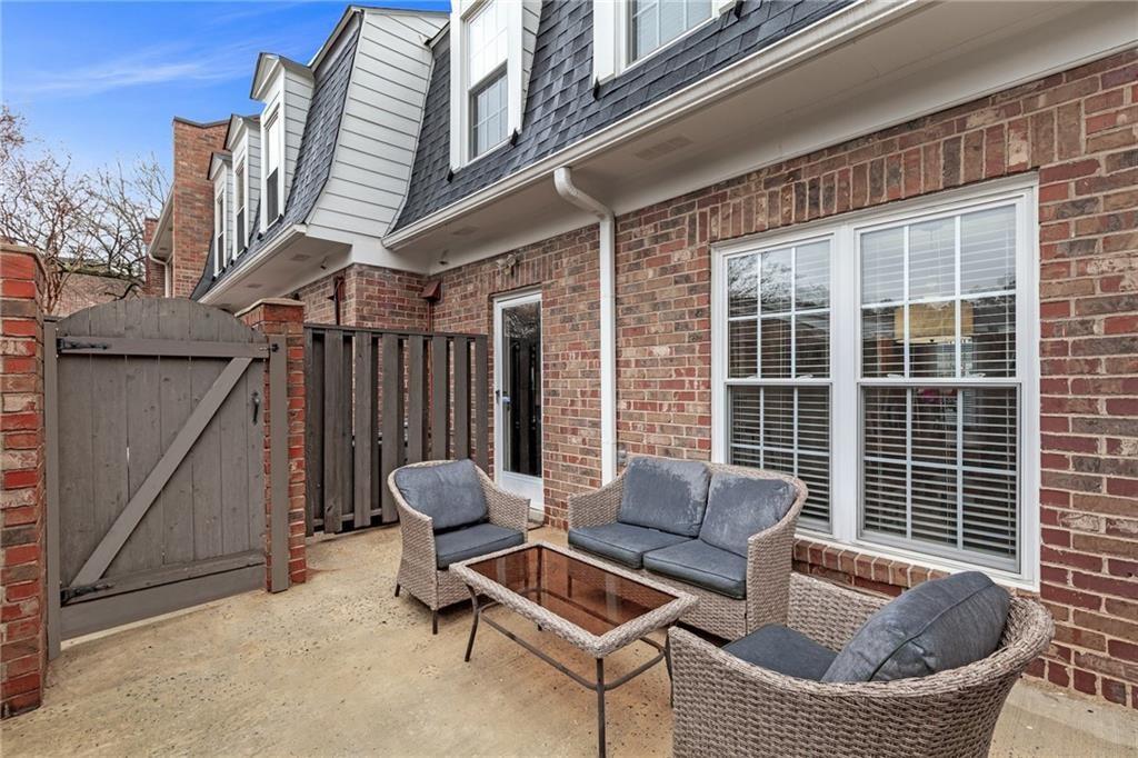12 Surry County Place Northwest Atlanta, GA 30318 - Photo 22 of 27 a outdoor living space with patio furniture and a potted plant