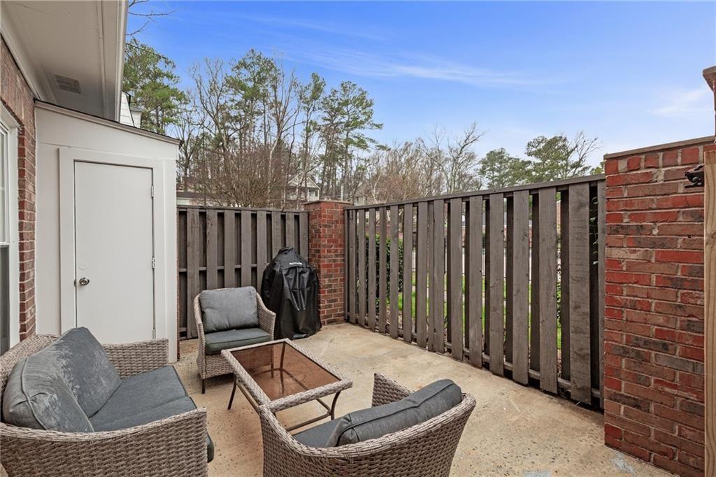 12 Surry County Place Northwest Atlanta, GA 30318 - Photo 23 of 27 a balcony with furniture and a potted plant