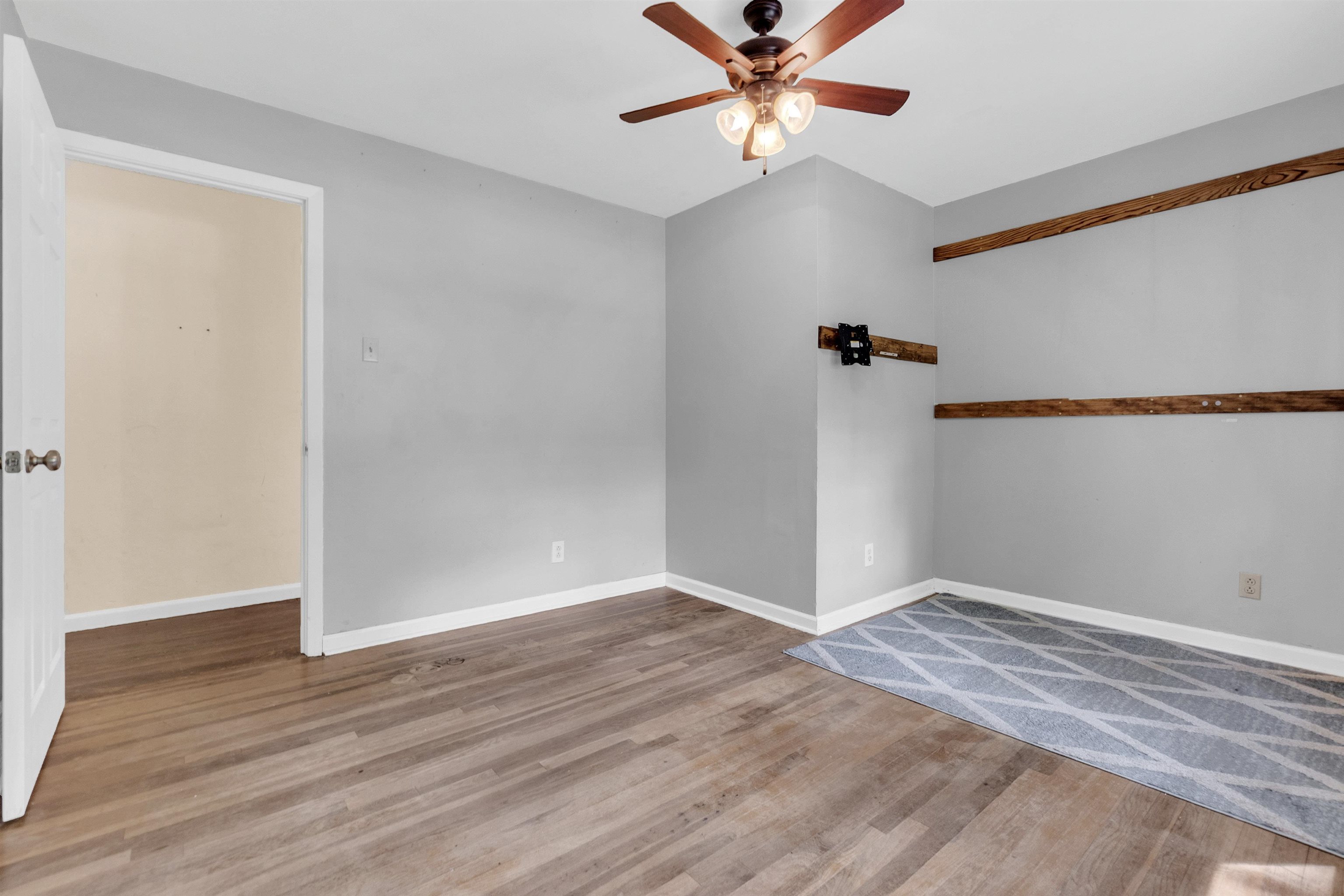 3024 Keats Road Bartlett, TN 38134 - Photo 19 of 32 Empty room featuring ceiling fan and wood finished floors