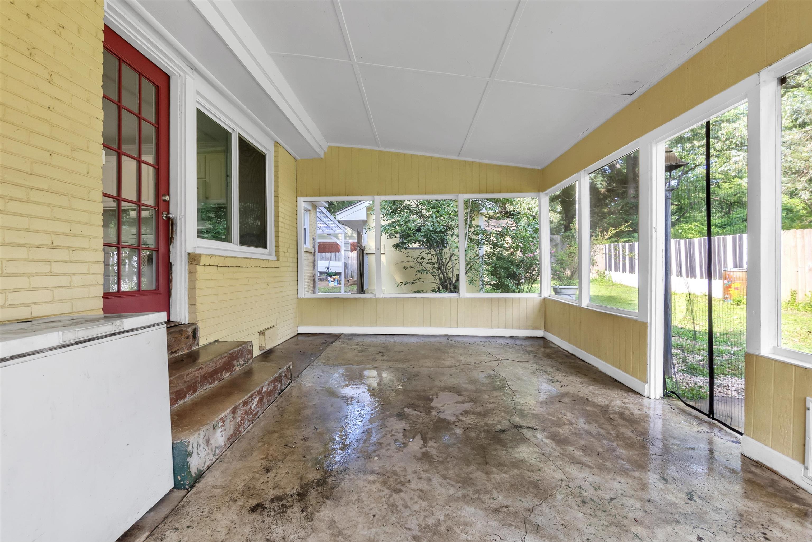 3024 Keats Road Bartlett, TN 38134 - Photo 27 of 32 sunroom with healthy amount of natural light, concrete flooring, wood walls, and lofted ceiling