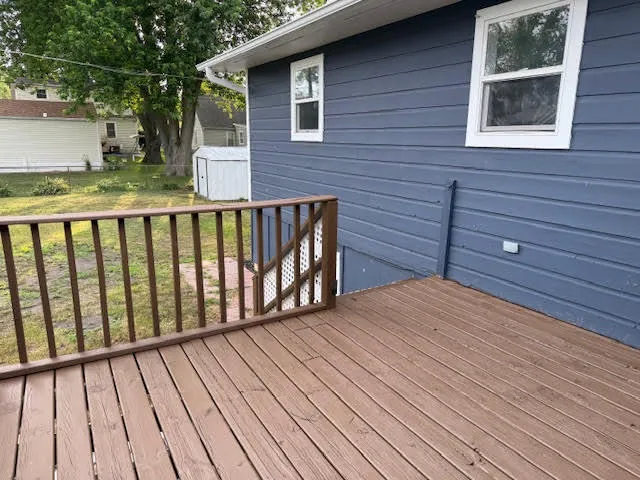 a view of backyard with a deck