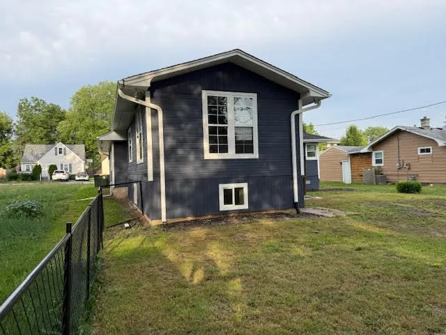 a backyard of a house with seating space