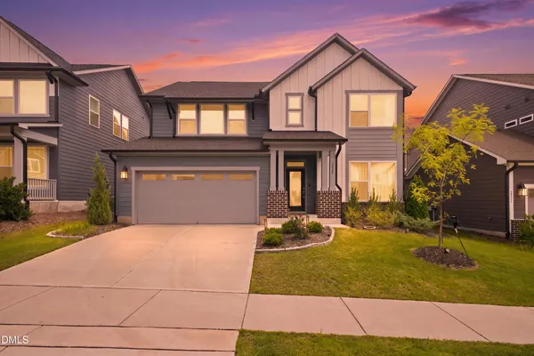 a front view of a house with yard