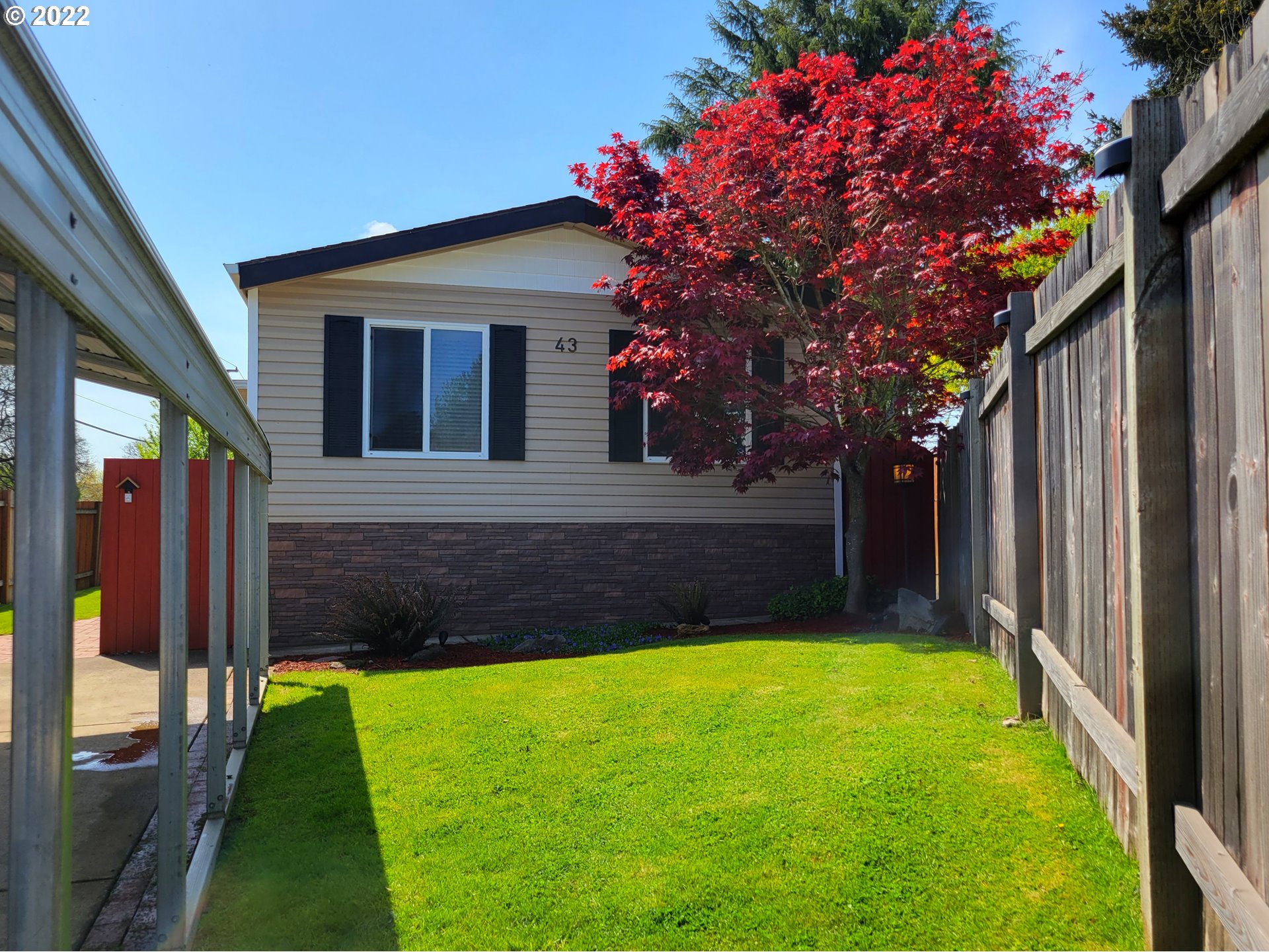 9811 Southwest Herman Road, Unit 43 Tualatin, OR 97062 - Photo 1 of 32 a front view of a house with a yard